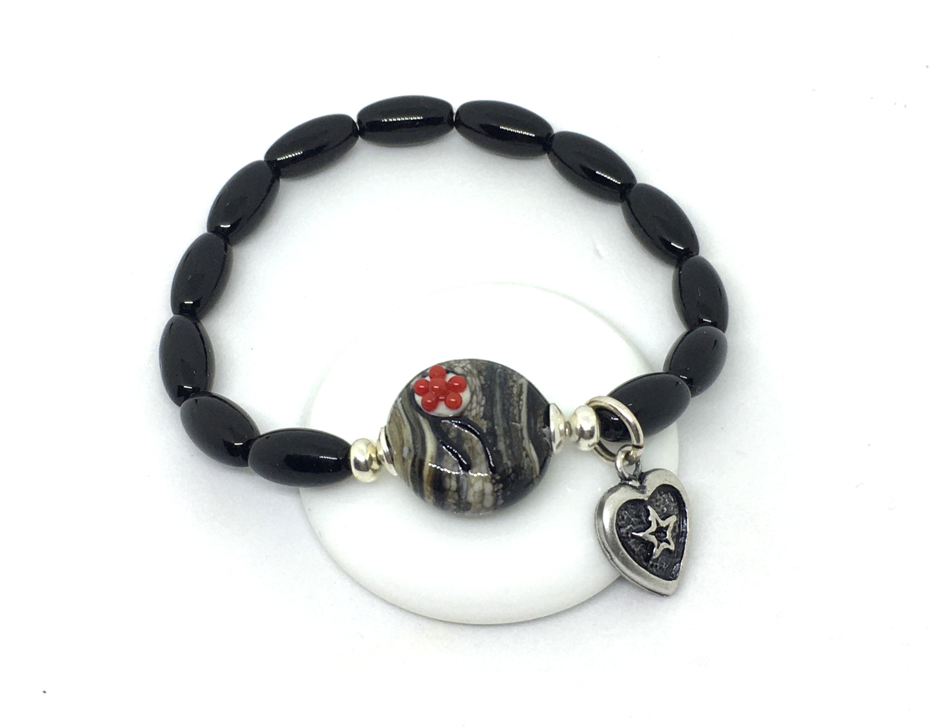 Armband mit Bollenhut aus Glas, Hornoptik