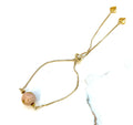 Armband mit Glasperle in rosa, gold