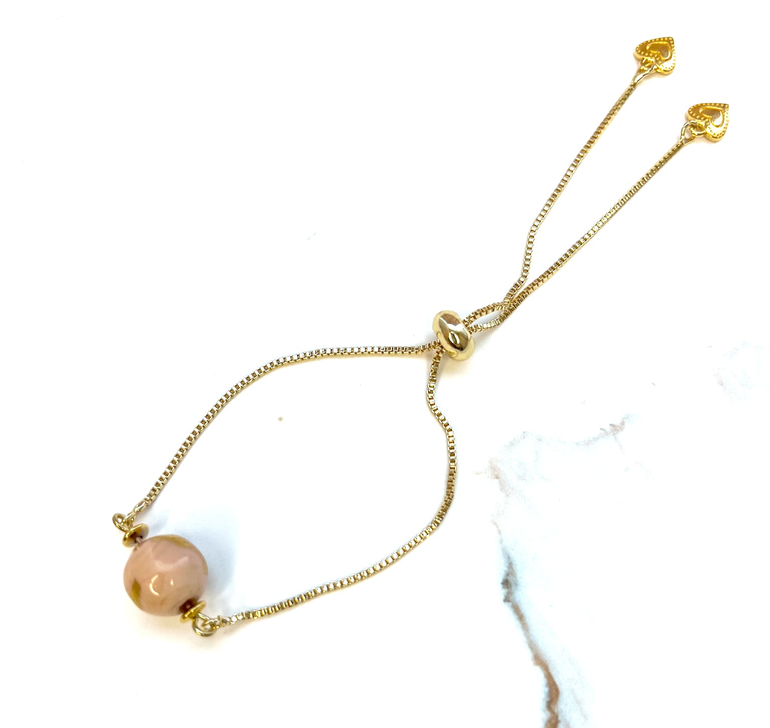 Armband mit Glasperle in rosa, gold